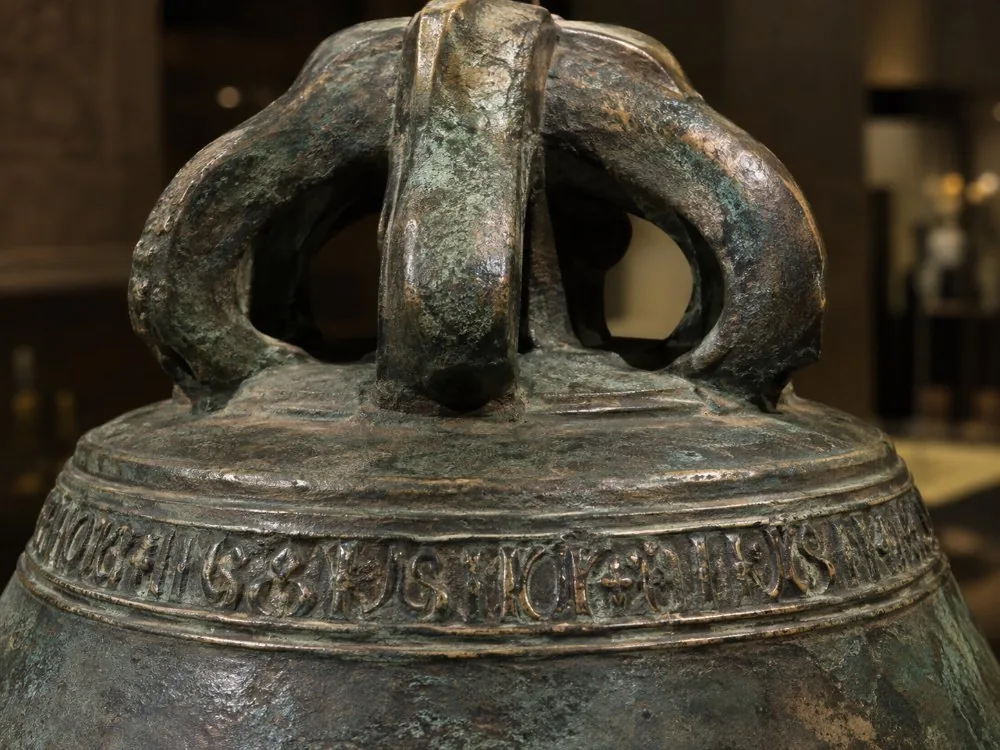 Raised lettering around the crown of the Liberty Bell