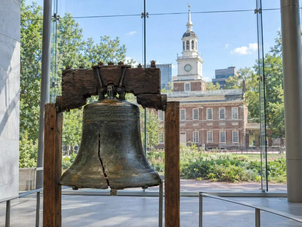 The glass-walled Liberty Bell Center with Independence Hall behind it